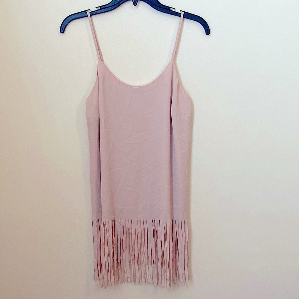 Tank top style fringed bottom top. Nude/soft pink color size XS